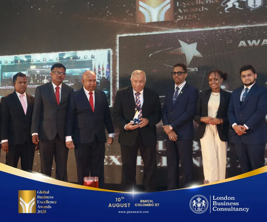 GBE Awards leadership group with award recipient