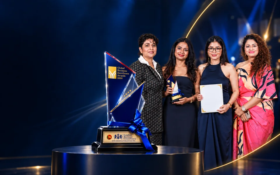 Women in Excellence campaign artwork showing four women and a blue and gold award
