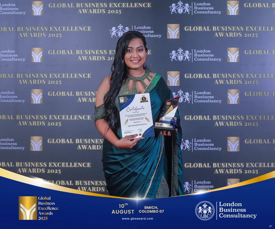 A GBE Awards recipient holding her certificate and trophy